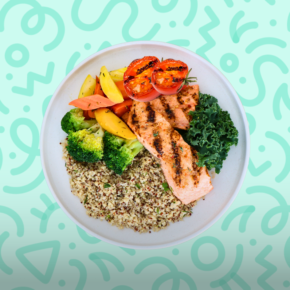 Omega-3 rich grilled salmon with quinoa, steamed broccoli, kale, and roasted tomatoes for athlete muscle recovery on a teal background.