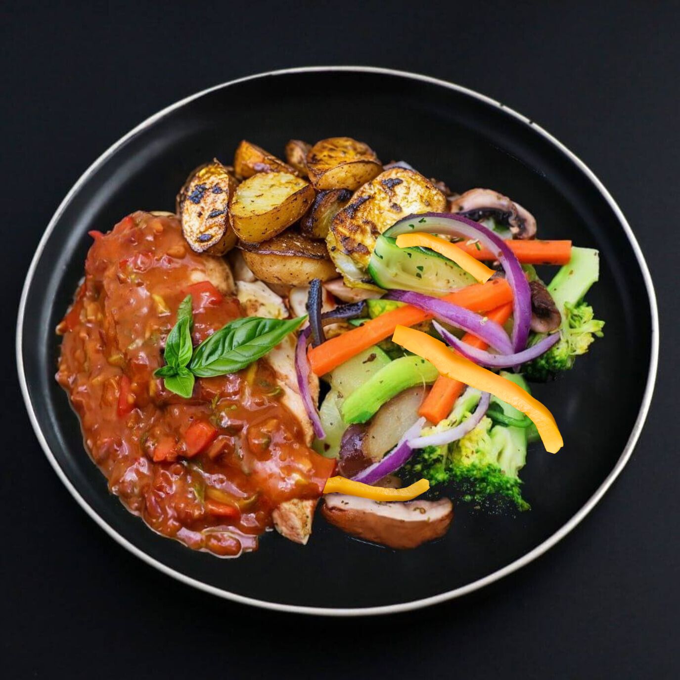 A plate of Thai Chicken Curry with roasted potatoes and a variety of vegetables, including broccoli and carrots.