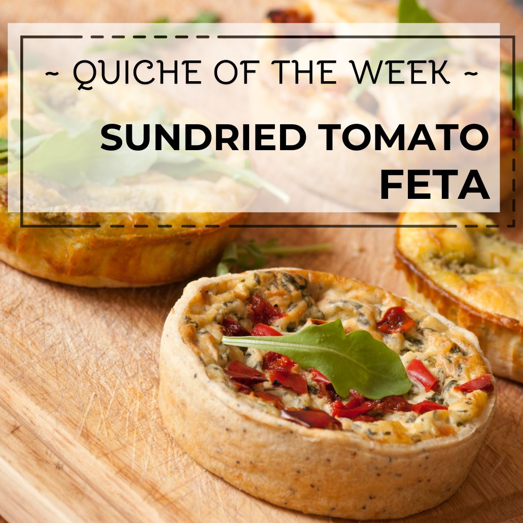 Sundried tomato feta quiche on a wooden board with text overlay