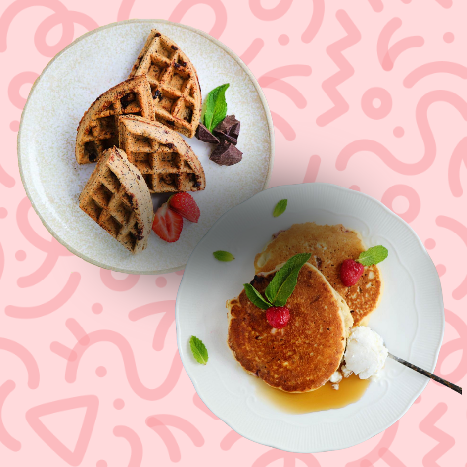 Healthy breakfast meal plan featuring protein waffles with blueberries and cream, whole grain pancakes with fresh raspberries and blueberries, and a side of sliced strawberries on a pink patterned background.